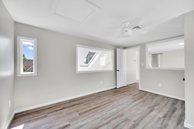 233 Mansfield Grove Rd Unit 306, East Haven, CT 06512 - spare room with wood finished floors, a ceiling fan, and attic access
