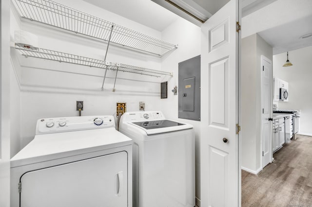 233 Mansfield Grove Rd Unit 306, East Haven, CT 06512 - laundry area with independent washer and dryer, electric panel, and wood finished floors
