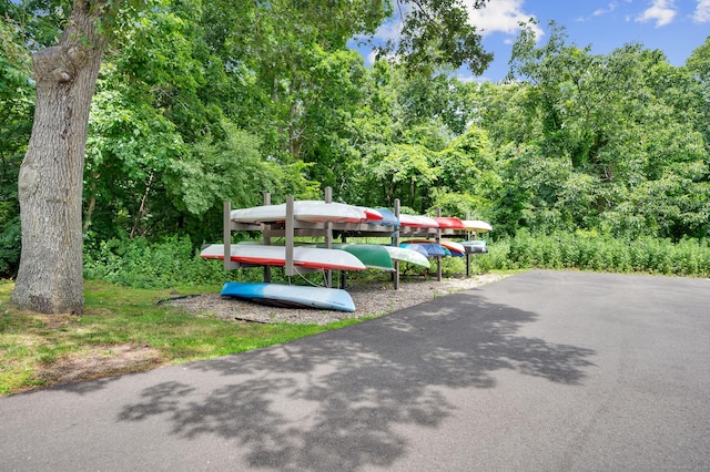 233 Mansfield Grove Rd Unit 306, East Haven, CT 06512 - view of parking featuring a wooded view
