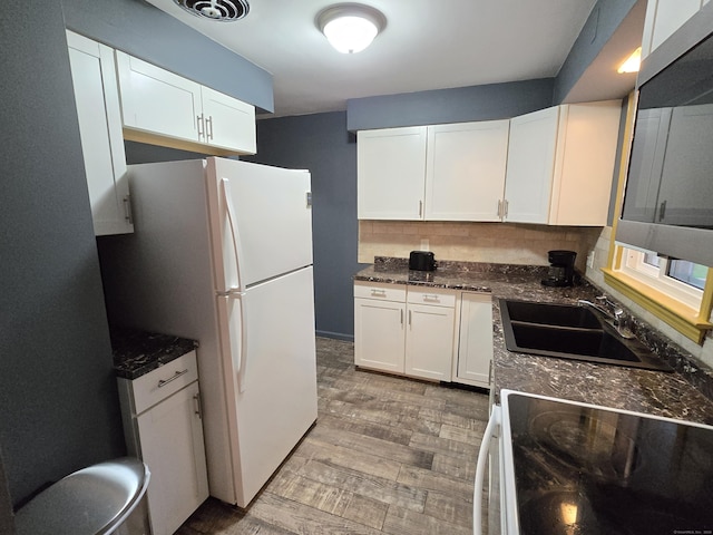 1190 Meriden Rd, Waterbury, CT 06705 - kitchen with white appliances, white cabinetry, tasteful backsplash, and light wood finished floors