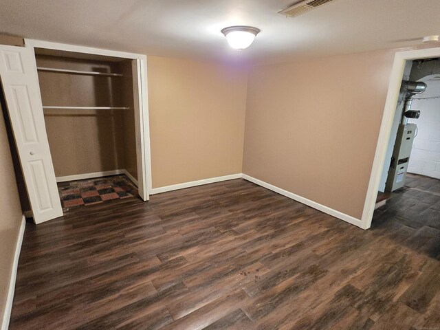 1190 Meriden Rd, Waterbury, CT 06705 - unfurnished bedroom with dark wood-style floors and a closet
