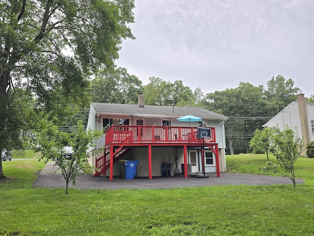1190 Meriden Rd, Waterbury, CT 06705 - back of property with a wooden deck, a patio area, a lawn, a chimney, and stairway