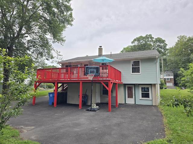 1190 Meriden Rd, Waterbury, CT 06705 - rear view of house with a deck and a chimney