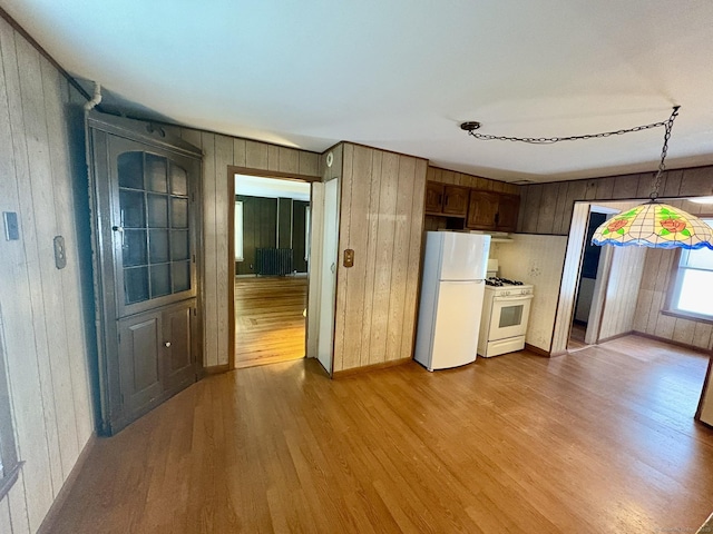 2 Sherwood St, Branford, CT 06405 - kitchen featuring white appliances, wood finished floors, and wood walls