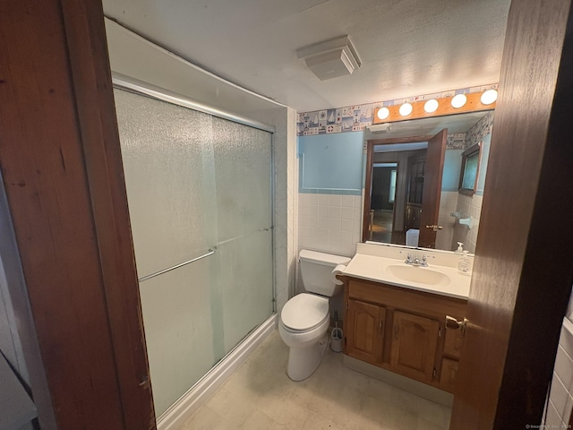 2 Sherwood St, Branford, CT 06405 - bathroom featuring a shower stall, vanity, tile walls, and tile patterned floors