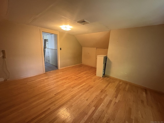 2 Sherwood St, Branford, CT 06405 - additional living space featuring light wood-type flooring and vaulted ceiling