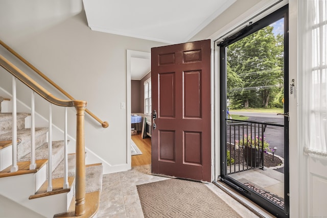 1182 N Main St, West Hartford, CT 06117 - foyer featuring stairs, healthy amount of natural light, crown molding, and light tile patterned flooring