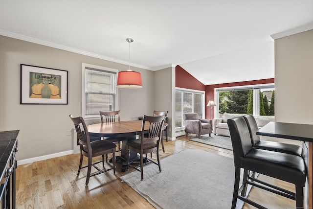 1182 N Main St, West Hartford, CT 06117 - dining space featuring light wood-style floors, crown molding, and lofted ceiling