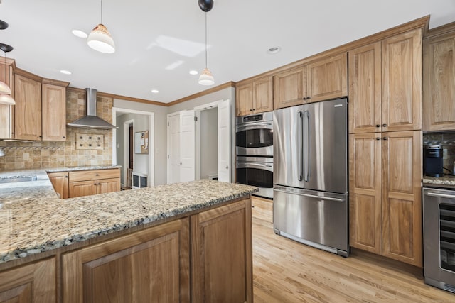 1182 N Main St, West Hartford, CT 06117 - kitchen featuring appliances with stainless steel finishes, wall chimney exhaust hood, wine cooler, decorative backsplash, and light stone counters