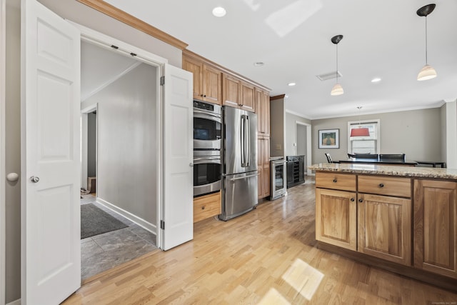 1182 N Main St, West Hartford, CT 06117 - kitchen with stainless steel appliances, crown molding, beverage cooler, decorative light fixtures, and light stone counters