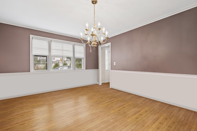 1182 N Main St, West Hartford, CT 06117 - spare room featuring a chandelier, wood finished floors, and crown molding
