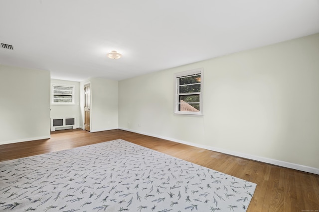 1182 N Main St, West Hartford, CT 06117 - spare room with wood finished floors and plenty of natural light