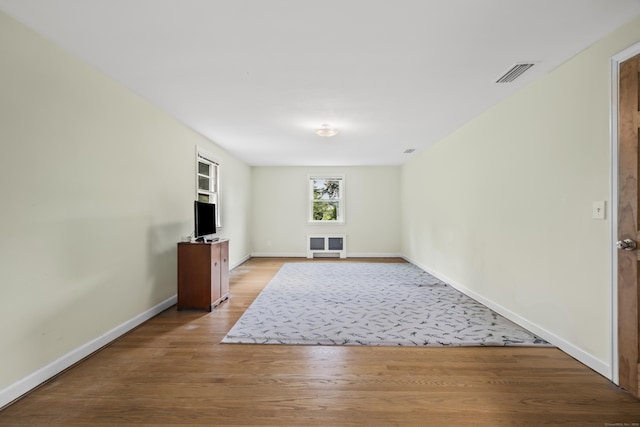 1182 N Main St, West Hartford, CT 06117 - unfurnished living room featuring light wood-type flooring and baseboards