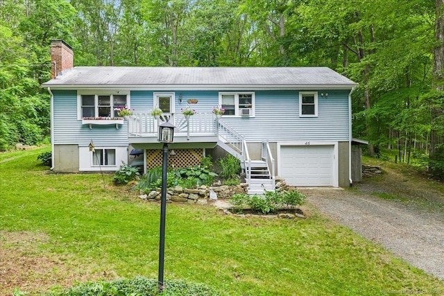 46 Union Dr, Ashford, CT 06278 - view of front facade featuring gravel driveway, a chimney, a garage, a front lawn, and stairs