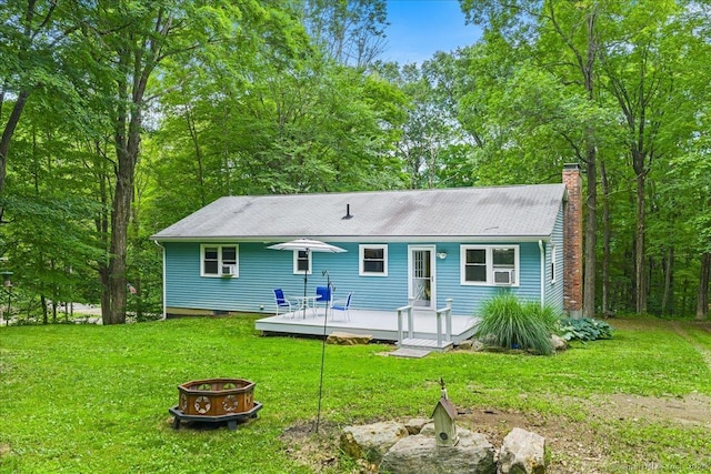 46 Union Dr, Ashford, CT 06278 - rear view of house with an outdoor fire pit, a wooden deck, a yard, and a chimney