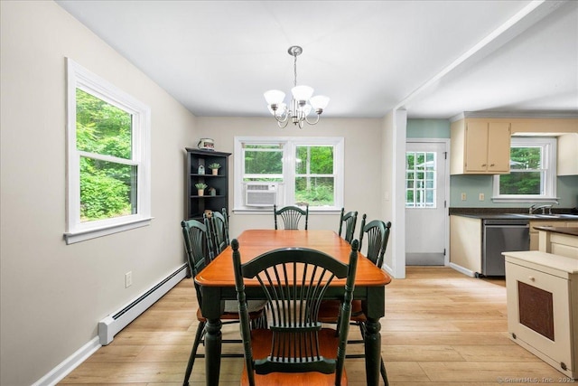 46 Union Dr, Ashford, CT 06278 - dining space with baseboard heating, cooling unit, a chandelier, and light wood-style floors