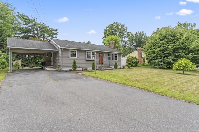 119 Debra Ln, Bristol, CT 06010 - ranch-style house featuring an attached carport, driveway, a front lawn, a chimney, and roof with shingles