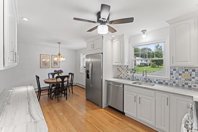 119 Debra Ln, Bristol, CT 06010 - kitchen with appliances with stainless steel finishes, white cabinetry, decorative backsplash, and recessed lighting