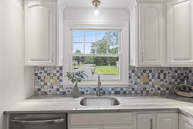 119 Debra Ln, Bristol, CT 06010 - kitchen with dishwasher, decorative backsplash, and white cabinets