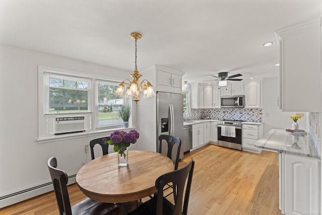 119 Debra Ln, Bristol, CT 06010 - dining room with light wood-style floors, a ceiling fan, a chandelier, recessed lighting, and a baseboard heating unit