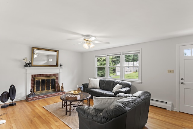 119 Debra Ln, Bristol, CT 06010 - living area featuring baseboard heating, healthy amount of natural light, a ceiling fan, and light wood-style floors