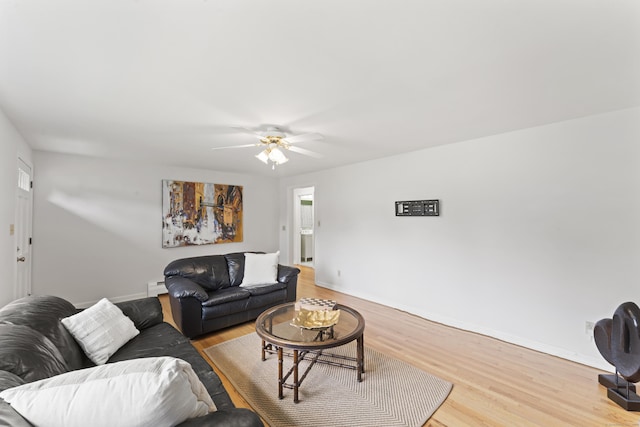 119 Debra Ln, Bristol, CT 06010 - living room featuring a ceiling fan, light wood-style flooring, and a baseboard heating unit
