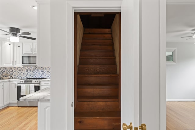 119 Debra Ln, Bristol, CT 06010 - staircase featuring a ceiling fan and wood finished floors