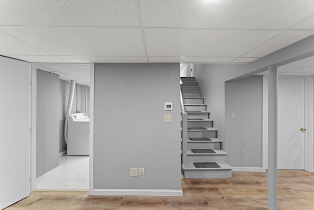 119 Debra Ln, Bristol, CT 06010 - finished basement with washer / clothes dryer, a paneled ceiling, stairway, and wood finished floors