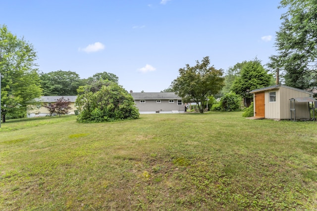 119 Debra Ln, Bristol, CT 06010 - view of grassy yard with a storage shed
