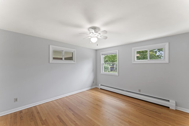119 Debra Ln, Bristol, CT 06010 - unfurnished room featuring baseboard heating, a ceiling fan, and wood finished floors