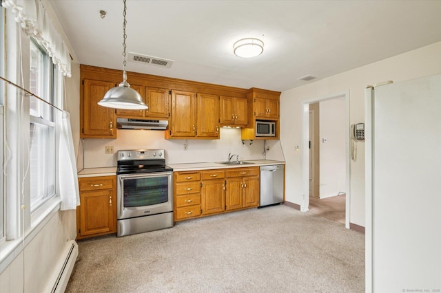 5 Hale Ct, Plainville, CT 06062 - kitchen featuring appliances with stainless steel finishes, under cabinet range hood, a baseboard heating unit, light countertops, and brown cabinets