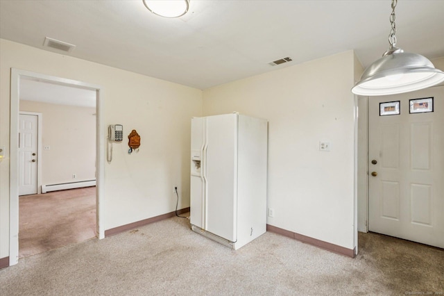 5 Hale Ct, Plainville, CT 06062 - garage with white refrigerator with ice dispenser and a baseboard radiator