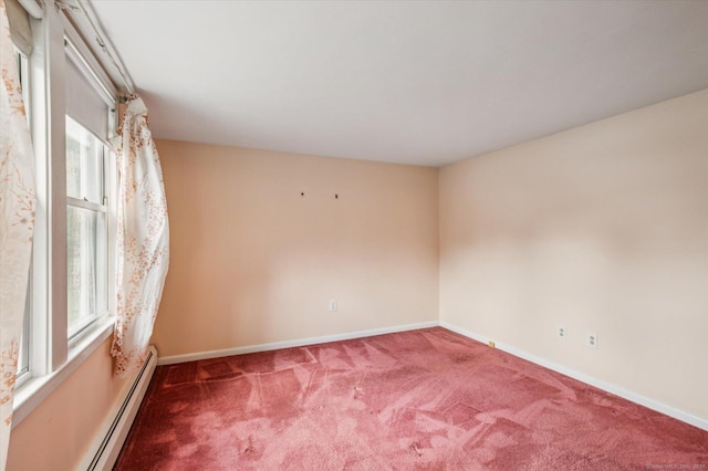 5 Hale Ct, Plainville, CT 06062 - carpeted empty room featuring a baseboard heating unit and plenty of natural light