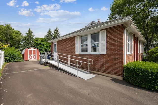 5 Hale Ct, Plainville, CT 06062 - view of home's exterior with brick siding and a storage shed