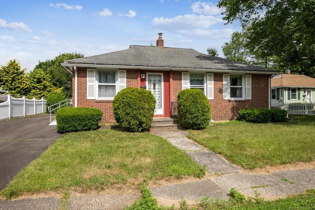 5 Hale Ct, Plainville, CT 06062 - view of front of home with brick siding, a chimney, roof with shingles, and driveway