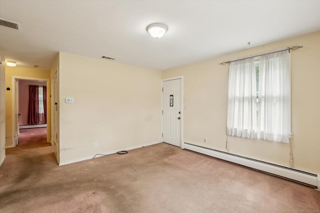 5 Hale Ct, Plainville, CT 06062 - empty room with a baseboard heating unit and carpet