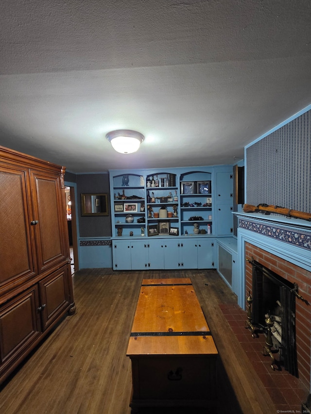 952 Boston Tpke, Coventry, CT 06238 - unfurnished living room featuring dark wood-type flooring and a brick fireplace