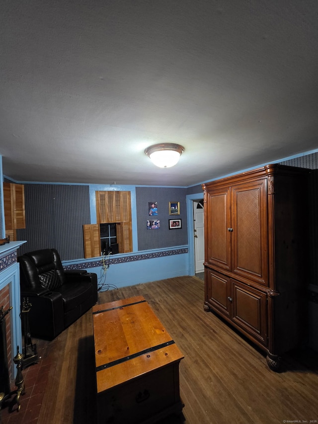 952 Boston Tpke, Coventry, CT 06238 - living area with a brick fireplace and dark wood-style flooring