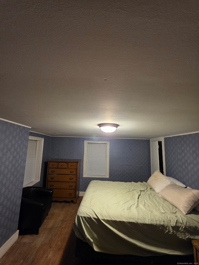 952 Boston Tpke, Coventry, CT 06238 - bedroom featuring wallpapered walls and dark wood finished floors