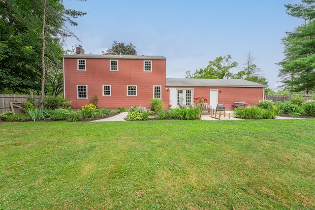 148 Depot St, East Windsor, CT 06016 - back of property featuring a chimney, a patio, and french doors