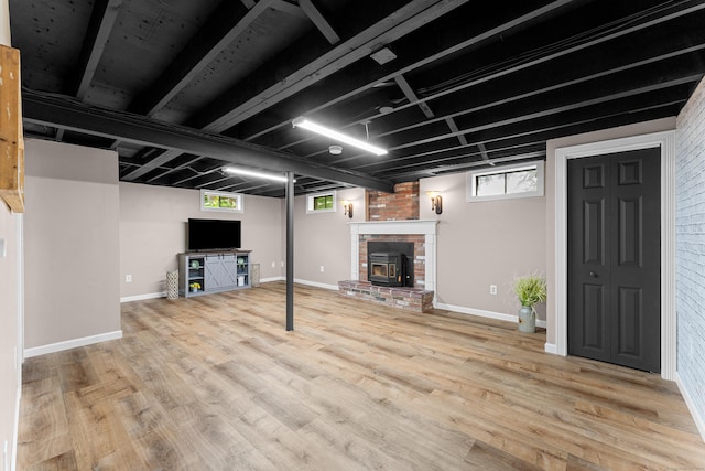 148 Depot St, East Windsor, CT 06016 - basement featuring wood finished floors, healthy amount of natural light, and a fireplace