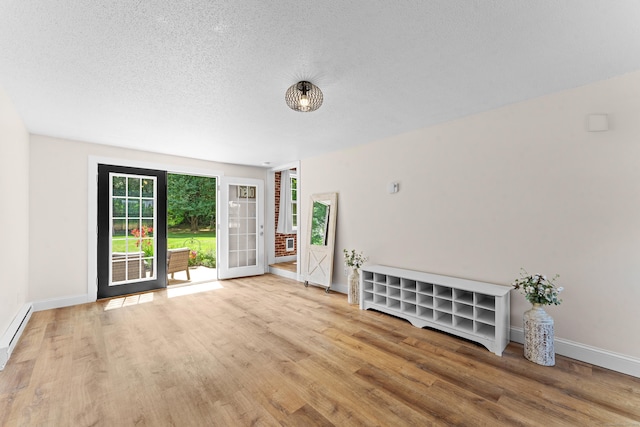 148 Depot St, East Windsor, CT 06016 - empty room featuring wood finished floors and a textured ceiling