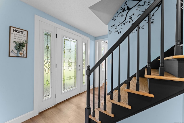 148 Depot St, East Windsor, CT 06016 - entryway with stairs and wood finished floors