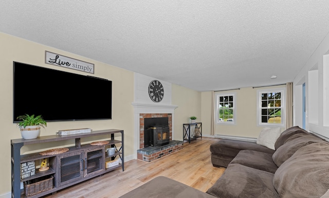 148 Depot St, East Windsor, CT 06016 - living area with a baseboard heating unit, wood finished floors, and a textured ceiling