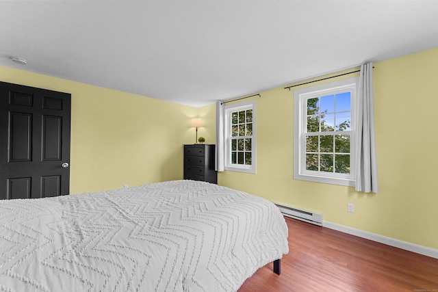 148 Depot St, East Windsor, CT 06016 - bedroom with baseboard heating and wood finished floors
