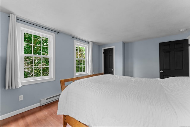 148 Depot St, East Windsor, CT 06016 - bedroom featuring a baseboard radiator and wood finished floors