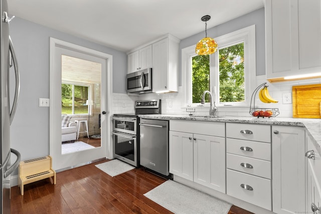 50 Spring Glen Dr, Granby, CT 06035 - kitchen with stainless steel appliances, dark wood finished floors, healthy amount of natural light, and white cabinets
