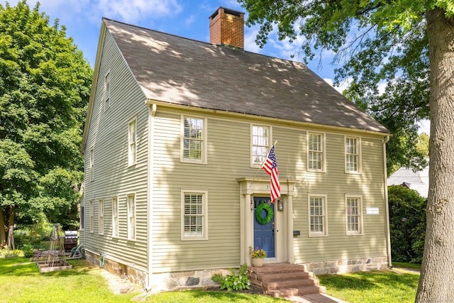 319 Main St, Wethersfield, CT 06109 - colonial inspired home with a chimney, a front yard, and a shingled roof