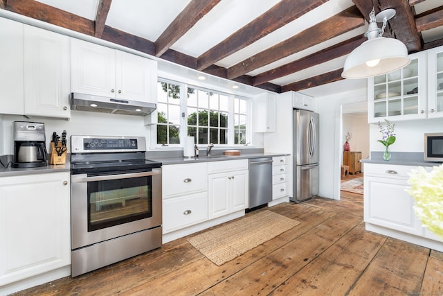 319 Main St, Wethersfield, CT 06109 - kitchen with stainless steel appliances, under cabinet range hood, beamed ceiling, dark wood-style flooring, and glass insert cabinets