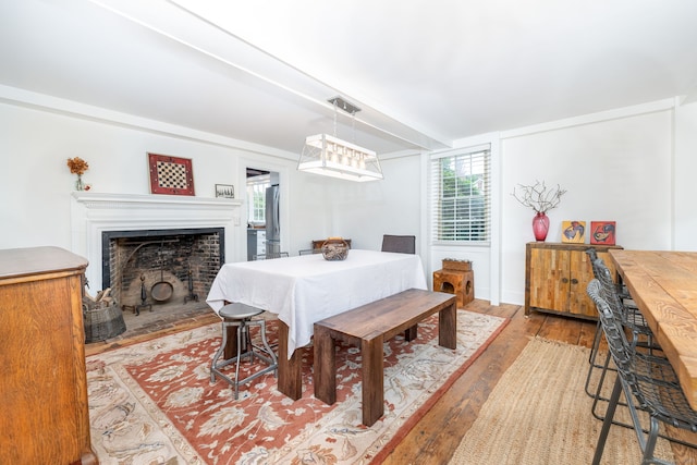 319 Main St, Wethersfield, CT 06109 - dining room featuring wood finished floors and a fireplace with flush hearth